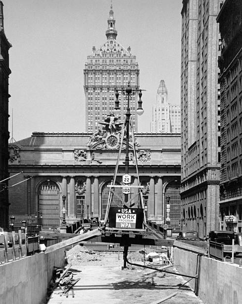 1930s STREET CONSTRUCTION IN FRONT OF GRAND CENTRAL STATION WITH SIGN WPA DEPRESSION AGENCY NEW YORK CITY USA