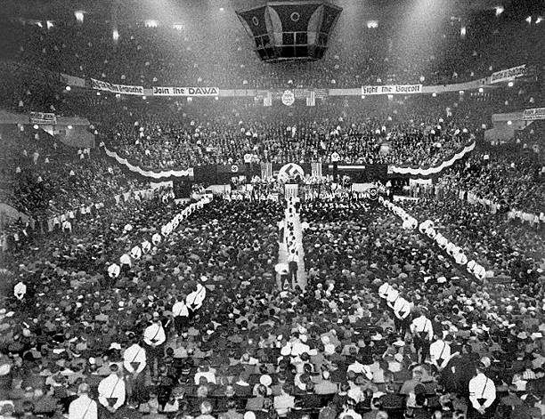 About 20000 supporters attend a Nazi rally at Madison Square Garden on the night as 1000 police keep 600 Communist protesters outside.
