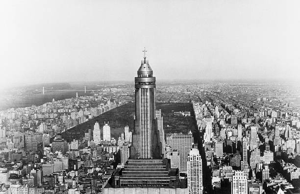 An aerial view of Midtown Manhattan with the Empire State Building in the foreground overlooking Central Park and the buildings of New York.
