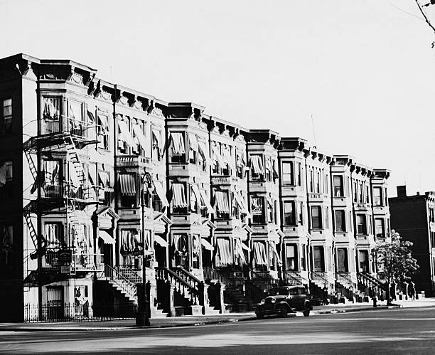 Brownstone apartments on Madison Avenue at 122nd Street Harlem New York City circa 1935.