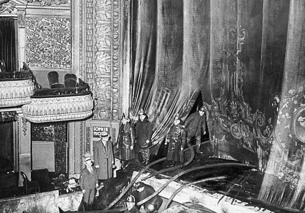 Flames flashing out from behind curtain where fireman enters blew into the orchestra pit in the Palace Theatre on Feb. 17 as Sophie Tucker finished