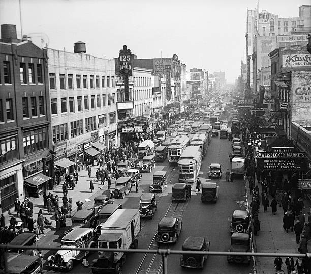 Looking east from 8th Avenue at the traffic and buildings on 125th Street in Harlem Manhattan. The Apollo Theater is at left. Riots broke out here