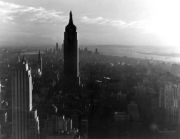 Looking south at sunset at the Empire State Building and midtown Manhattan New York New York circa 1938.
