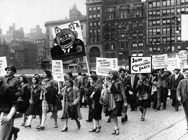 Marchers carrying signs during a Communist rally in New York City.