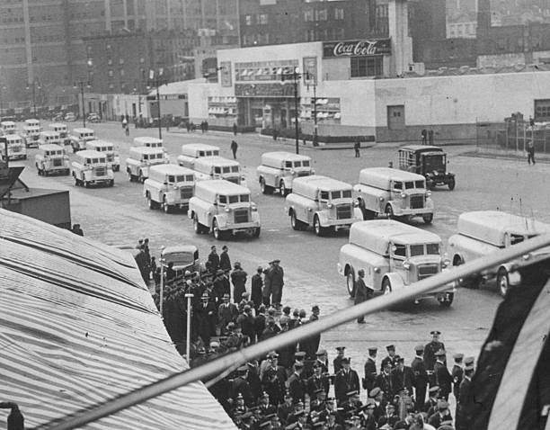 Parade of Sanitation Department trucks on 22nd St. And Ave. C.