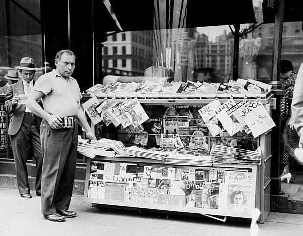 Phillip Krassner next to his modern newsstand on 34th Street and Broadway.