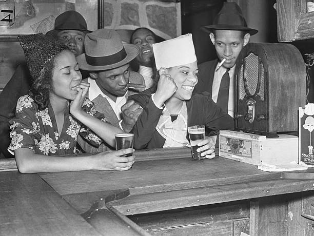 The scene in one of Harlem's bars as the population of New York's colored district celebrated the victory of Joe Louis over Max Schmeling of Germany.