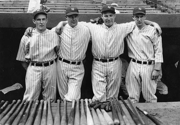 The starting pitching staff of the New York Yankees pose in the dugout on May 17 1932. They are Johnny Allen George Pipgras Red Ruffing and Lefty