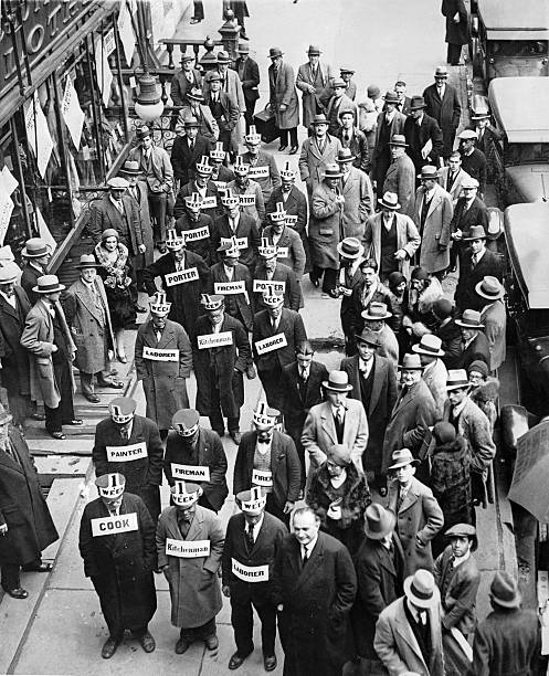 Unemployed persons demonstrated in Times Square New York. They are wearing signs which state their professions and which offer to work for a dollar