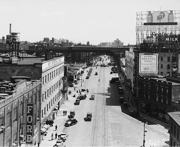 View down 125th Street Harlem New York City circa 1935.