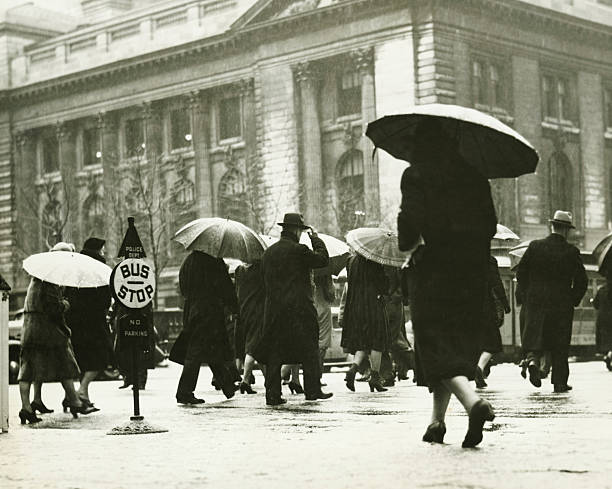 Pedestrians walking in rain in new york city