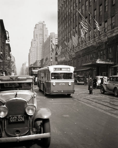 1930s POLICE TRAFFIC OFFICER TAXI LEXINGTON AVENUE BUS AT EAST 59TH STREET IN FRONT OF BLOOMINGDALES DEPARTMENT STORE NYC NY USA