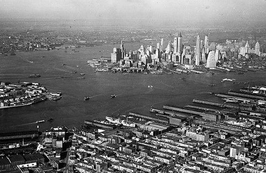 Air view of lower Manhattan from Brooklyn with Governor's Island to the left. General view of area for proposed vehicular tunnel between the Battery