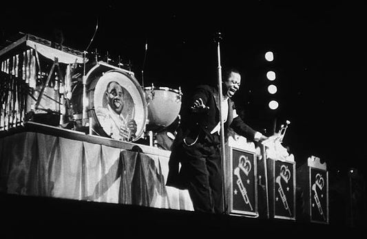American jazz singer and trumpeter Louis Armstrong performs with his orchestra at the Paramount Theater in New York May 1937.