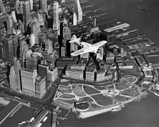 An aerial view of Captain Frank Hawks' new speed plane as he flew it over New York's Battery Park and Financial District New York New York April