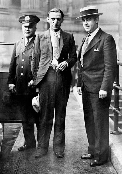 Anthony Trobino flanked by Officer Donoghue and Detective Peppi leaves Supreme Court after the Grand Jury investigated the shooting of five