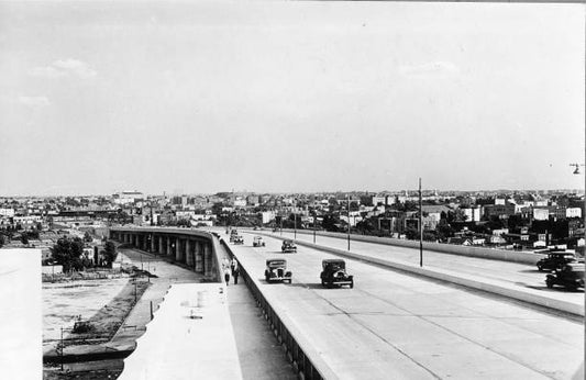 Cars travel on the Triborough Bridge ramp to Astoria Queens New York City.