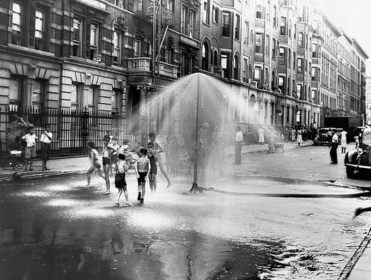 Children playing in water sprayed from a sprinkler in South Harlem. New York Crime Prevention Photos of Juvenile Aid Bureau New York New York
