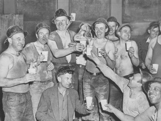 Construction workers celebrate the holing through of the last connecting link for the Sixth Avenue subway between 8th and 53rd Streets.