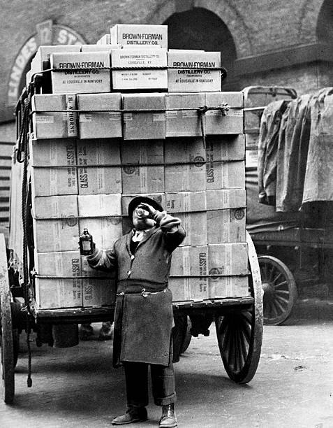 Delivering legal liquor the day after repeal driver Tony Pasquale takes a drink of Kentucky whiskey at Beach and Varick Sts.