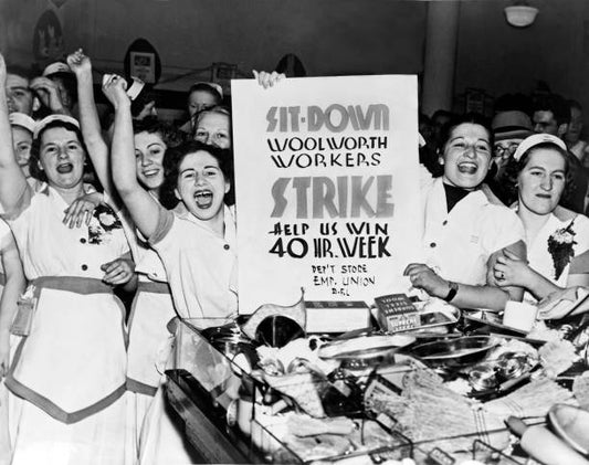 Female employees of Woolworth's holding a sign indicating they are striking for a 40 hour work week New York New York 1937.