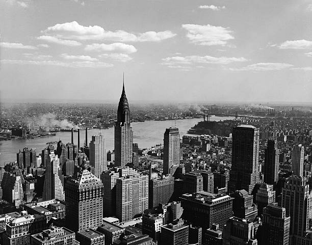 High angle view of the East Midtown skyline looking across the East River towards Queens and Brooklyn New York New York 1930s or 1940s. Prominant