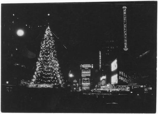 Illuminated Christmas tree at night Times Square New York New York 1930. Lighted advertisements include those for Chevrolet Pepsodent Hell's