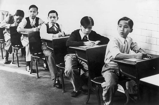 In 1937 young immigrants of Asian origin pictured in class on Ellis Island in the port of New York where immigrant families await authorization to