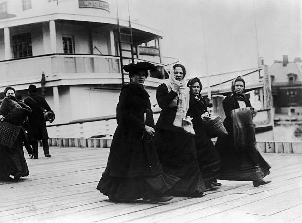 Irish Emigrants Disembarked Of The Cruise Ship Queen Mary At Ellis Island With Their Servants In 1930.