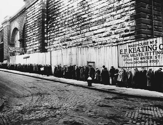 Long bread line near the Brooklyn bridge during the Great Depression. New York New York ca. 1930-1935.