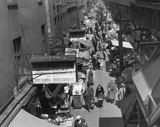 Market on First Avenue in a Jewish neighbourhood of Manhattan New York City circa 1935. A sign on the left advertises kosher meat and poultry