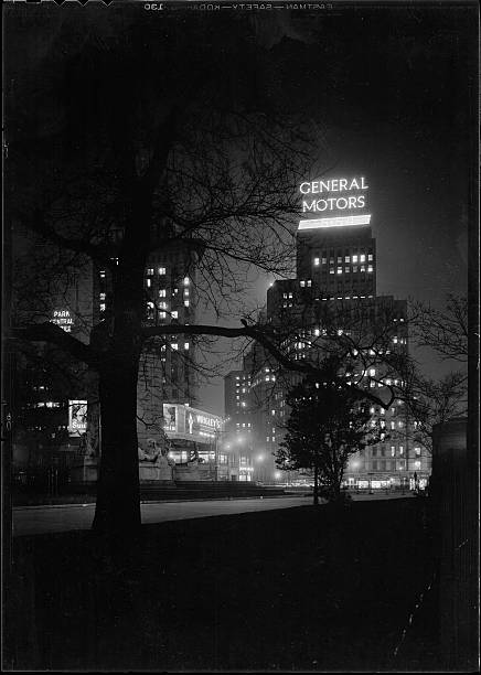 New York City views. General Motors building thru trees in park. General Motors Building