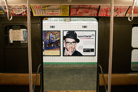 New advertisements are seen through the door of a vintage R1 New York City Subway car which was manufactured in the 1930s at the 23rd St. Station