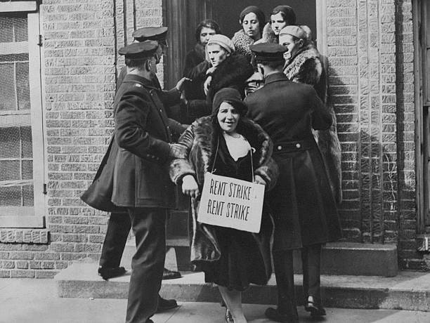 Police removing picketers from building during Bronx rent strike.