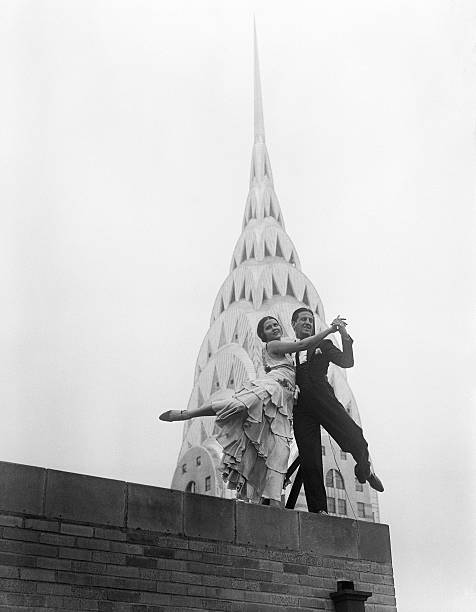 Quite a festive touch is lent to the majestic skyline of New York City by Ramon and Rosita internationally known dance artists as they demonstrate