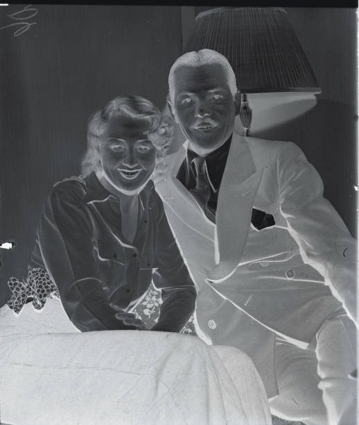 Screen Newlyweds. Joan Blondell popular screen star and her husband George Barnes movie cameraman are seen here in their suite at the St. Moritz