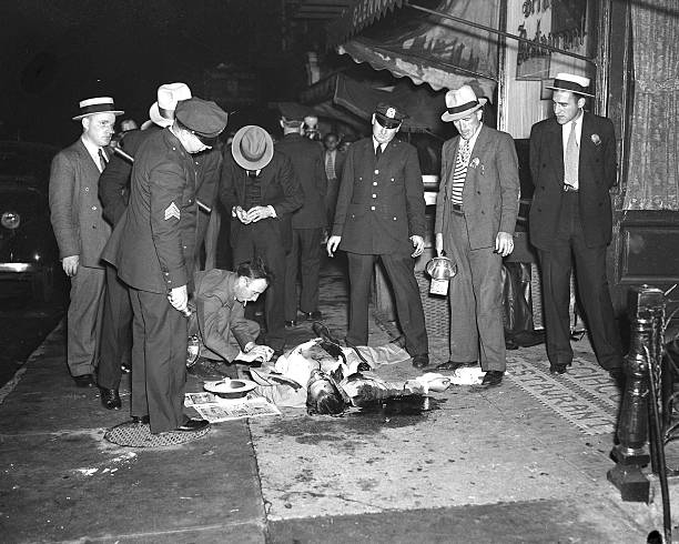 Shortly after a blonde dancer gave police important clues in the recent murders of three gangsters a fourth was laid low by screaming under-world