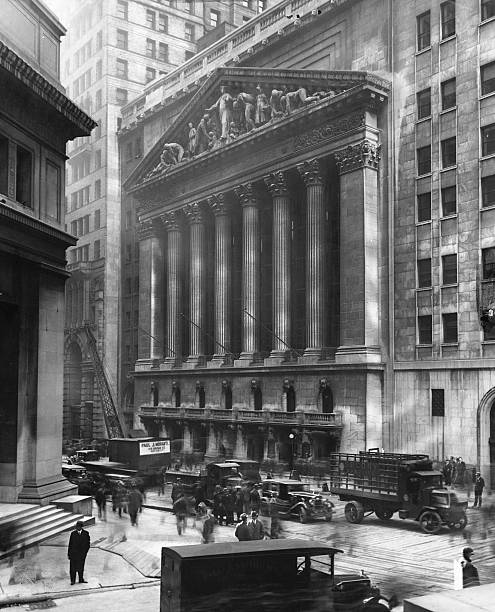 The offices of J.P. Morgan and Company stand opposite the columned facade of the New York Stock Exchange building in Manhattan's Wall Street.