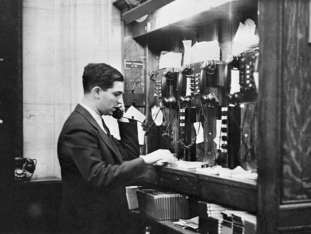 This is one of a series of photographs which reveal the complicated machinery of the New York Stock Exchange and how it is set in motion by even the