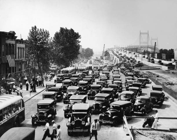 Traffic arriving on the Queens side of the Triborough Bridge New York City early 1930s. A traffic guard stands in the foreground.