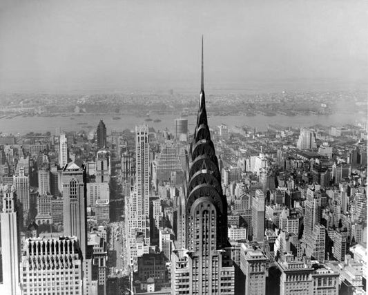 View of Midtown Manhattan looking west along 42nd Street with the Chrysler Building in the center New York mid 20th Century. New Jersey is visible
