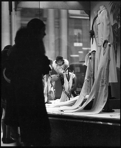 View of a woman window shopping on the streets of New York 1930.