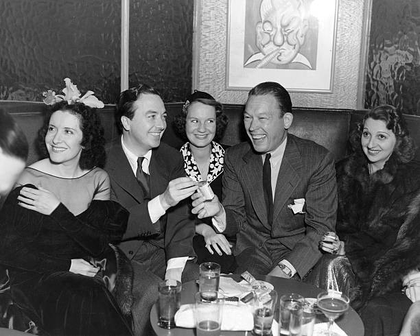 Visitors to the famous Sardi's Cafe include Gracie Allen the comedienne Jack Haley Fred Allen the radio comedian and Mary Livingston.