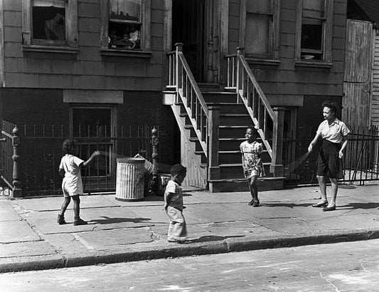 Woman and Children Playing Jump Rope
