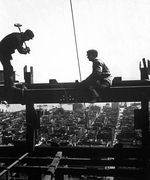 Workmen building a skyscraper in New York.