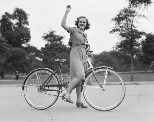 Young Virginia Lodge waves from a bicycle in New York City June 1938.