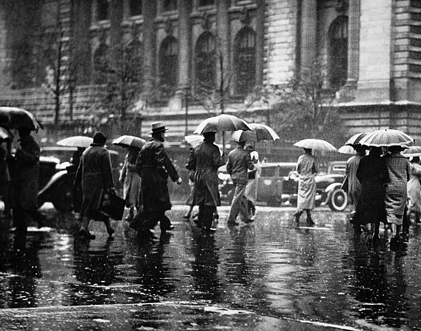 Pedestrian passing street rainy weather new york usa